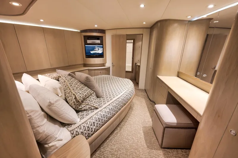 Slide: The Image of Luxurious cabin interior of 1993 Merritt Sportfish yacht with elegant bedding and modern design. - 22