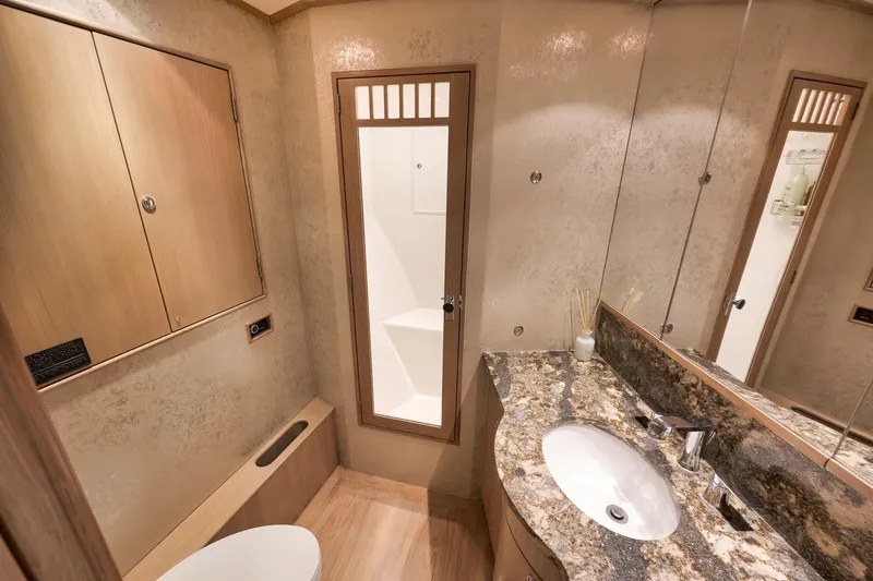 Slide: The Image of Luxurious bathroom in 1993 Merritt Sportfish yacht with granite countertop and modern fixtures. - 23