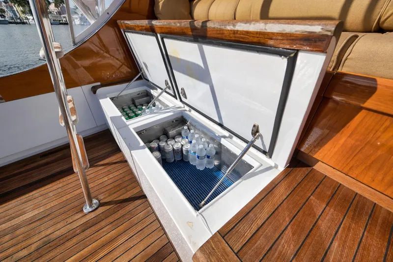 Slide: The Image of Built-in cooler on 1993 Merritt Sportfish boat deck, stocked with drinks. - 24