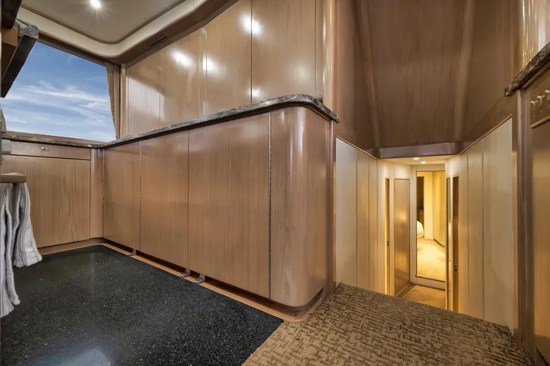 Slide: The Image of Luxurious interior of 1993 Merritt Sportfish yacht with wood paneling and modern design. - 32