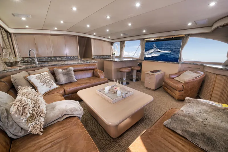 Slide: The Image of Luxurious interior of a 1993 Merritt Sportfish yacht with plush seating and ocean view. - 36