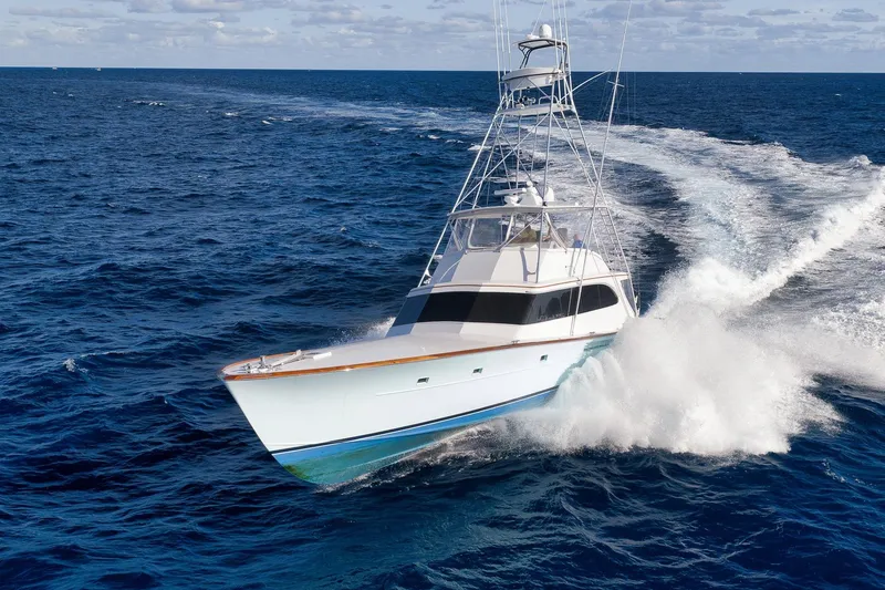 Slide: The Image of 1993 Merritt Sportfish yacht cruising swiftly on open ocean waters. - 39