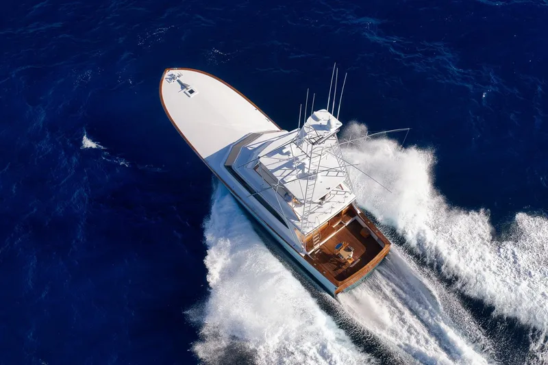 Slide: The Image of Aerial view of 1993 Merritt Sportfish yacht cruising through deep blue ocean waters. - 6