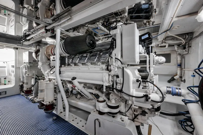 Slide: The Image of Engine room of a 1993 Merritt Sportfish boat, showcasing detailed mechanical components. - 11