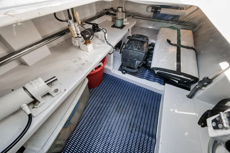 Slide: The Image of Interior of a 1993 Merritt Sportfish boat showing storage and equipment area. - 16