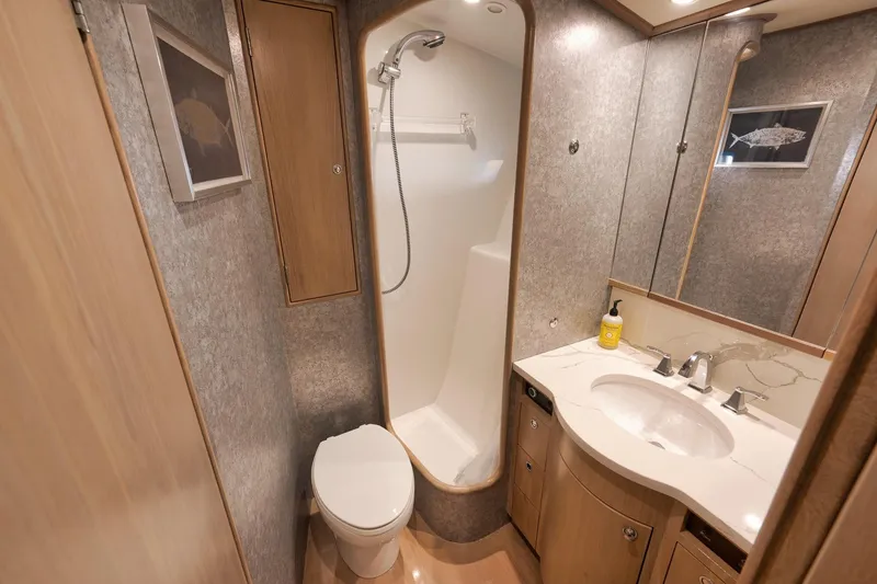 Slide: The Image of Luxurious 1993 Merritt Sportfish bathroom with shower, toilet, and vanity. - 18