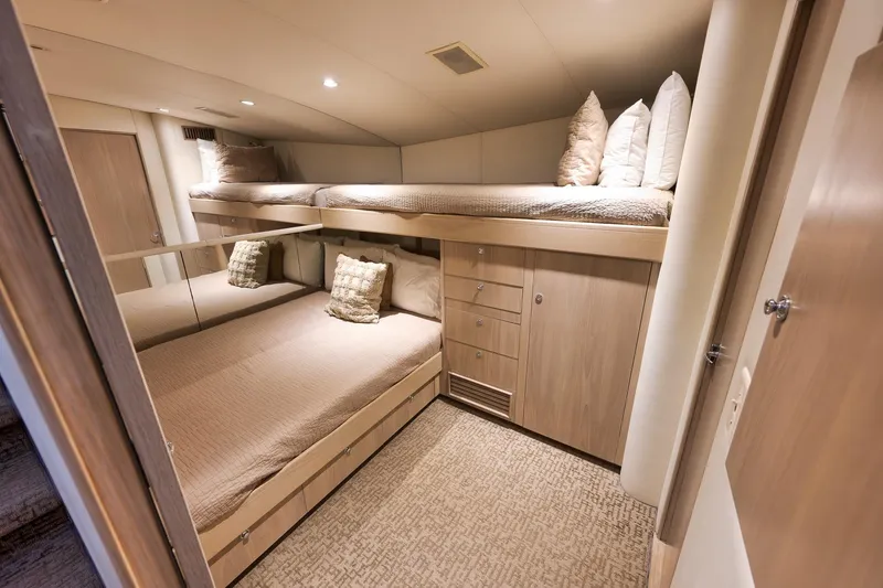 Slide: The Image of Luxurious cabin interior of 1993 Merritt Sportfish yacht with bunk beds and storage. - 20