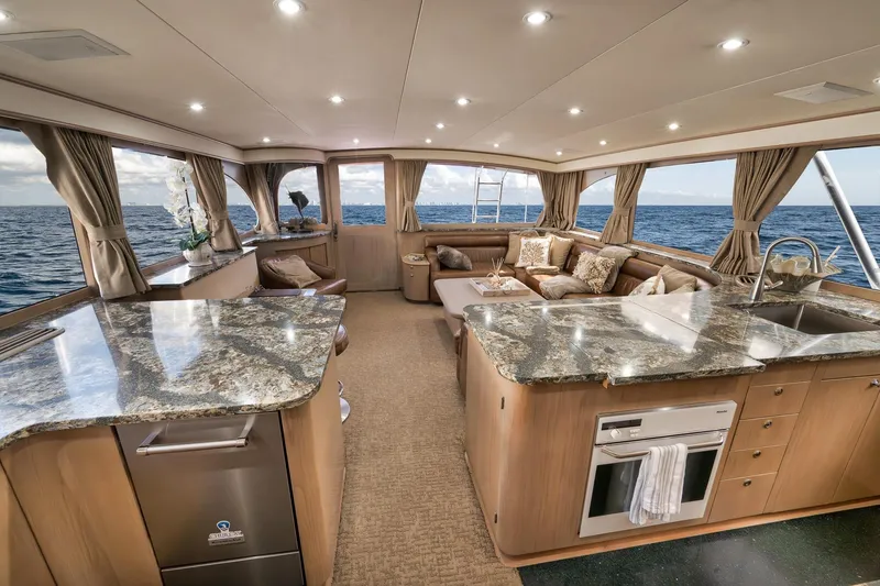 Slide: The Image of Luxurious 1993 Merritt Sportfish yacht interior with elegant granite countertops and ocean views. - 30