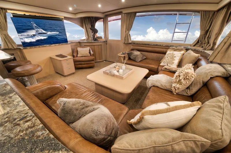 Slide: The Image of Luxurious interior of 1993 Merritt Sportfish yacht with plush seating and ocean view. - 35
