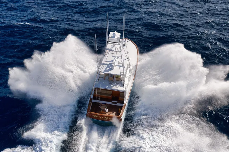 Slide: The Image of 1993 Merritt Sportfish yacht cruising through ocean waves, aerial view. - 5
