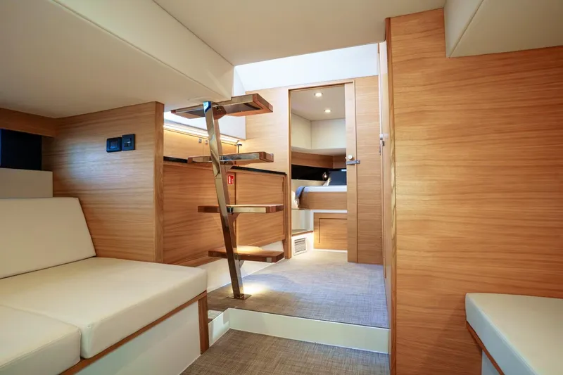 Slide: The Image of 2026 De Antonio Yachts D42 with spacious deck, modern seating, and sleek design. - 11