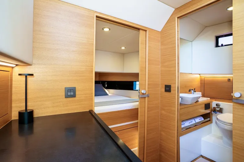 Slide: The Image of 2026 De Antonio Yachts D42 cockpit with modern helm, luxurious seating, and waterfront view. - 14