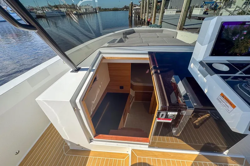 Slide: The Image of 2026 De Antonio Yachts D42 interior view with open hatch and modern amenities. - 29