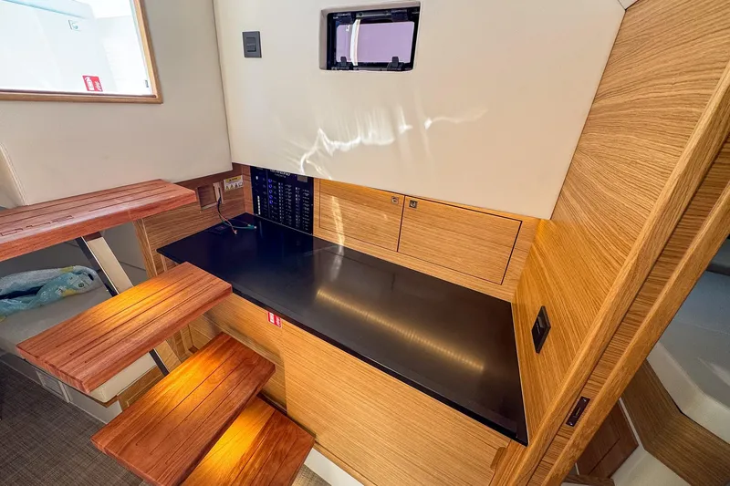 Slide: The Image of Interior of 2026 De Antonio Yachts D42, featuring sleek wooden stairs and modern design. - 31