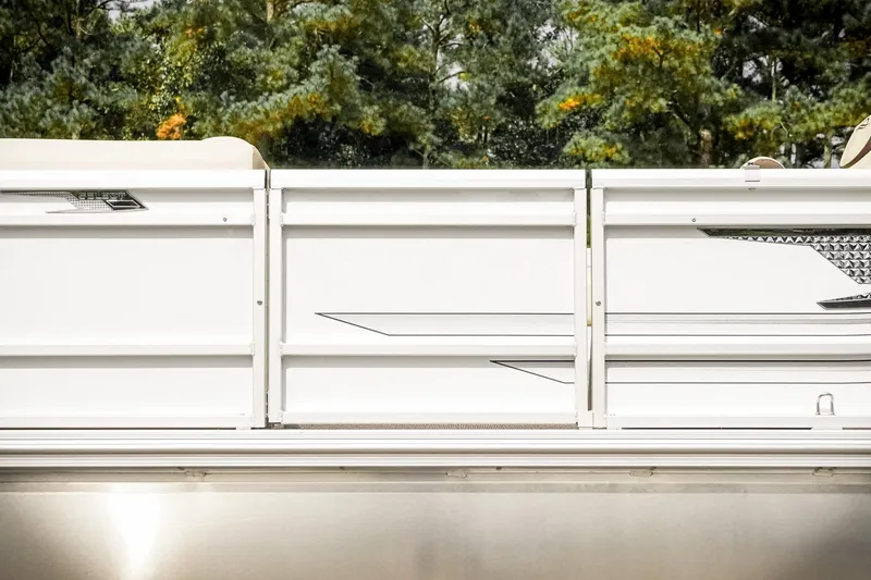 Slide: The Image of 2026 SunCatcher Select 22RC pontoon boat side view with forest background. - 16