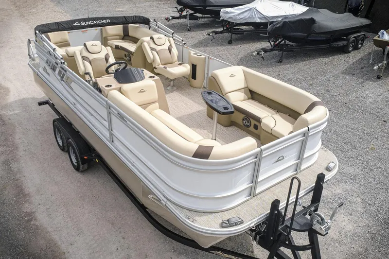 Slide: The Image of 2026 SunCatcher Select 22RC pontoon boat on trailer, featuring spacious seating and modern design. - 2