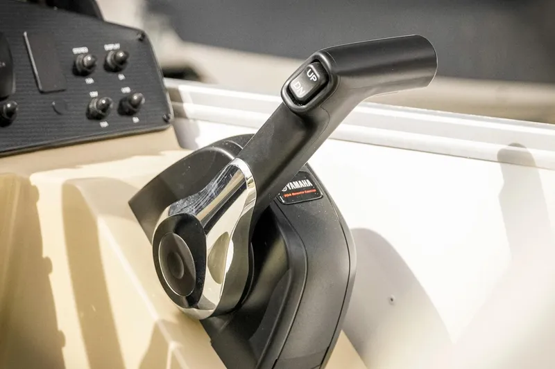 Slide: The Image of Close-up of a SunCatcher Select 22RC 2026 boat throttle control. - 20