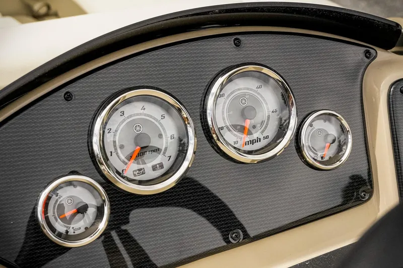 Slide: The Image of Dashboard of 2026 SunCatcher Select 22RC boat with speedometer and gauges. - 22