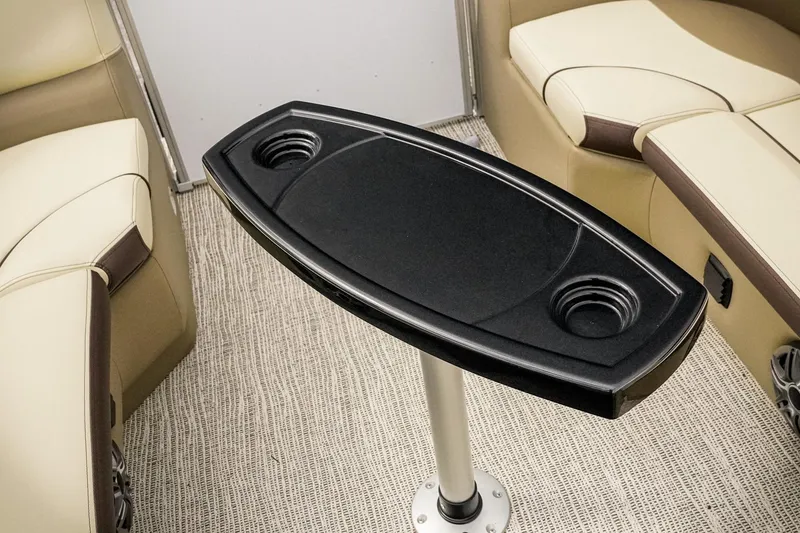 Slide: The Image of Interior of 2026 SunCatcher Select 22RC boat with table and cup holders. - 23