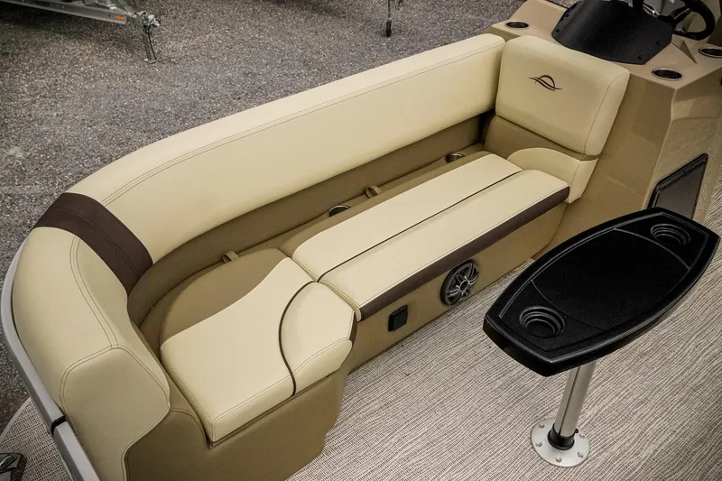 Slide: The Image of Luxurious seating on 2026 SunCatcher Select 22RC pontoon boat with beige upholstery and table. - 26