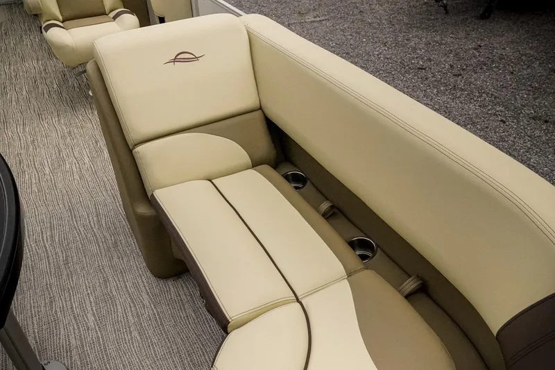Slide: The Image of Luxurious seating in 2026 SunCatcher Select 22RC boat with beige upholstery and cup holders. - 27