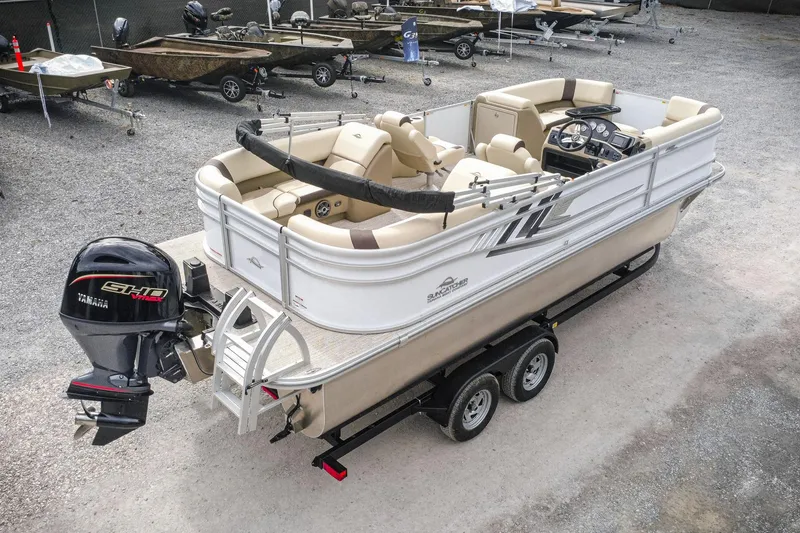 Slide: The Image of 2026 SunCatcher Select 22RC pontoon boat on trailer, featuring Yamaha outboard motor. - 3