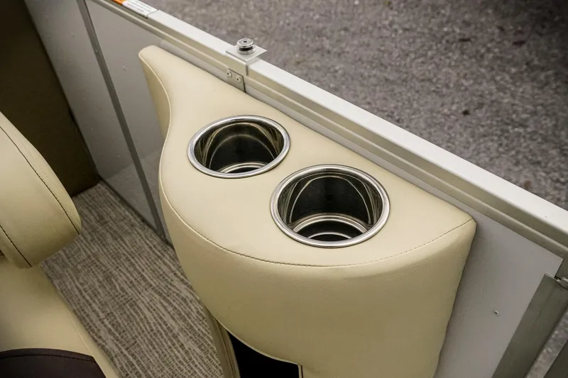 Slide: The Image of 2026 SunCatcher Select 22RC boat cup holders with beige upholstery. - 30