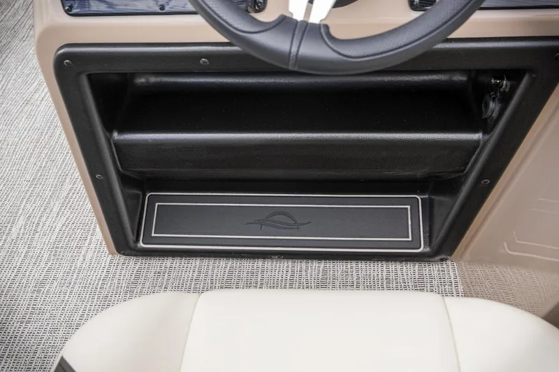 Slide: The Image of 2026 SunCatcher Select 22RC dashboard with steering wheel and storage compartment. - 37