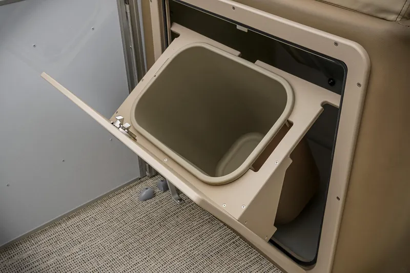 Slide: The Image of 2026 SunCatcher Select 22RC storage compartment with open hatch and beige interior. - 41