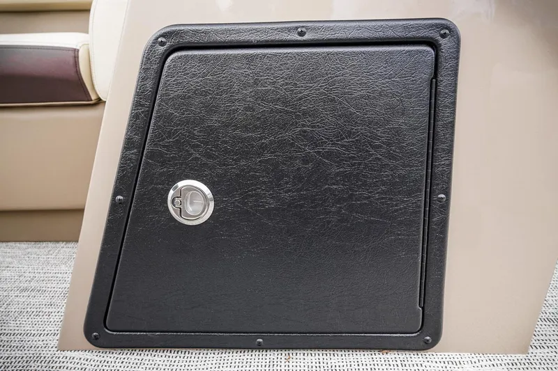 Slide: The Image of 2026 SunCatcher Select 22RC storage compartment with black textured door and silver handle. - 42