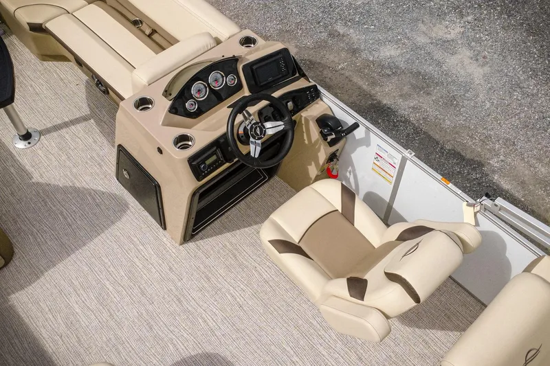 Slide: The Image of 2026 SunCatcher Select 22RC boat interior with beige seating and modern dashboard controls. - 6
