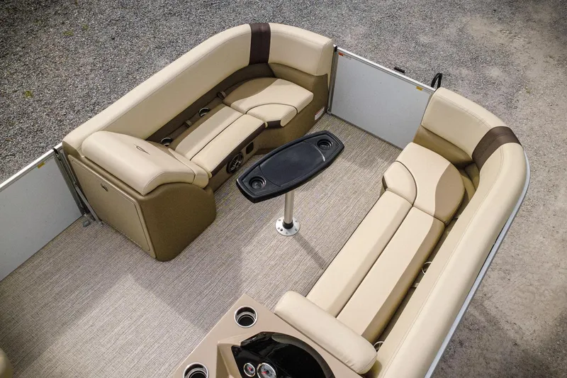Slide: The Image of 2026 SunCatcher Select 22RC boat interior with beige seating and central table. - 8