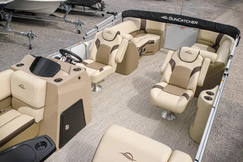 Slide: The Image of 2026 SunCatcher Select 22RC pontoon boat interior with luxurious seating and modern design. - 9