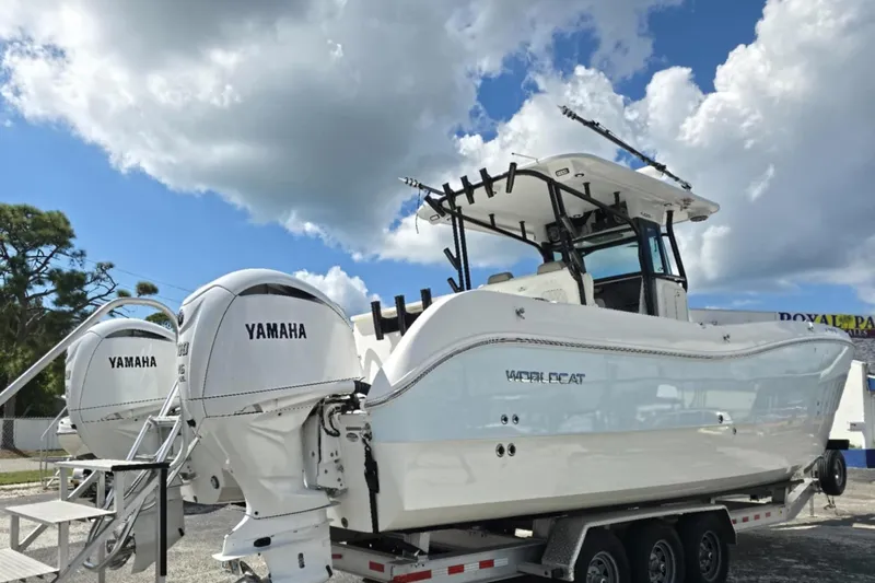 Slide: The Image of 2023 World Cat 325 CC boat with dual Yamaha engines on a trailer. - 20