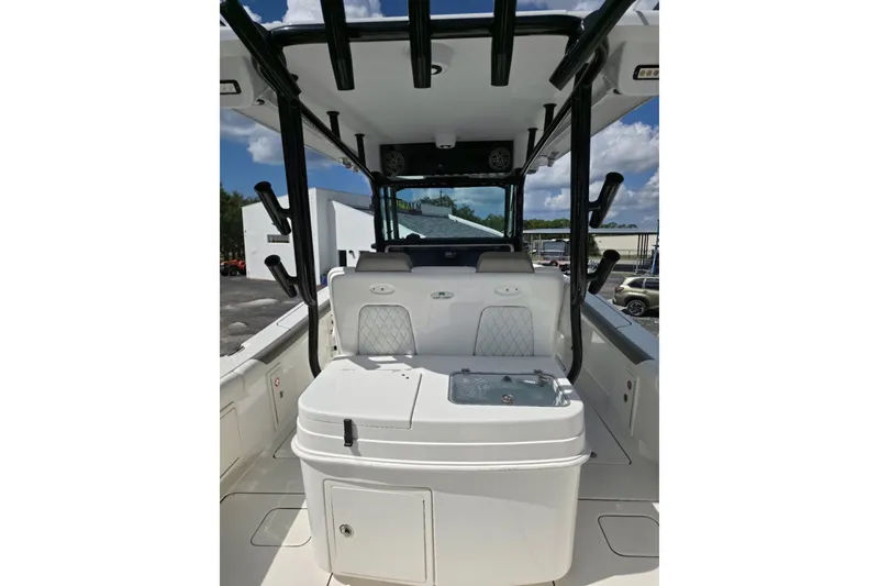 Slide: The Image of 2023 World Cat 325 CC boat interior with seating and storage compartments. - 23