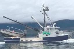 The Image of Custom Longliner 58 fishing boat from 1979 on calm waters with mountainous backdrop. - 0
