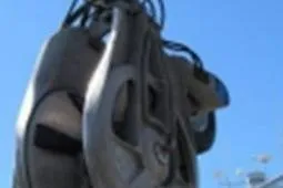 Slide: The Image of Close-up of a Custom Longliner 58 boat component, 1979 model, against a clear blue sky. - 15