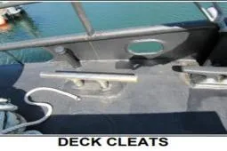 Slide: The Image of Deck cleats on 1979 Custom Longliner 58 boat, docked by the water. - 17