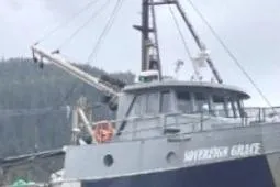 Slide: The Image of Custom Longliner 58 fishing boat, 1979 model, docked with mountainous backdrop. - 3