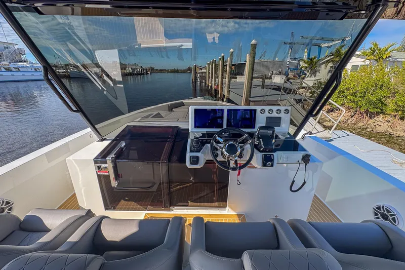 Slide: The Image of Helm of 2026 De Antonio Yachts D42, featuring modern controls and waterfront view. - 22
