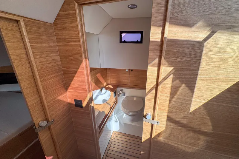 Slide: The Image of Modern bathroom interior of 2026 De Antonio Yachts D42, featuring wood paneling and compact design. - 34