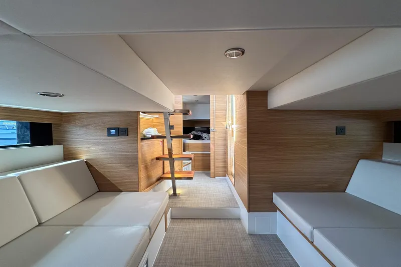 Slide: The Image of Luxurious interior of 2026 De Antonio Yachts D42, featuring modern wood and white upholstery. - 41
