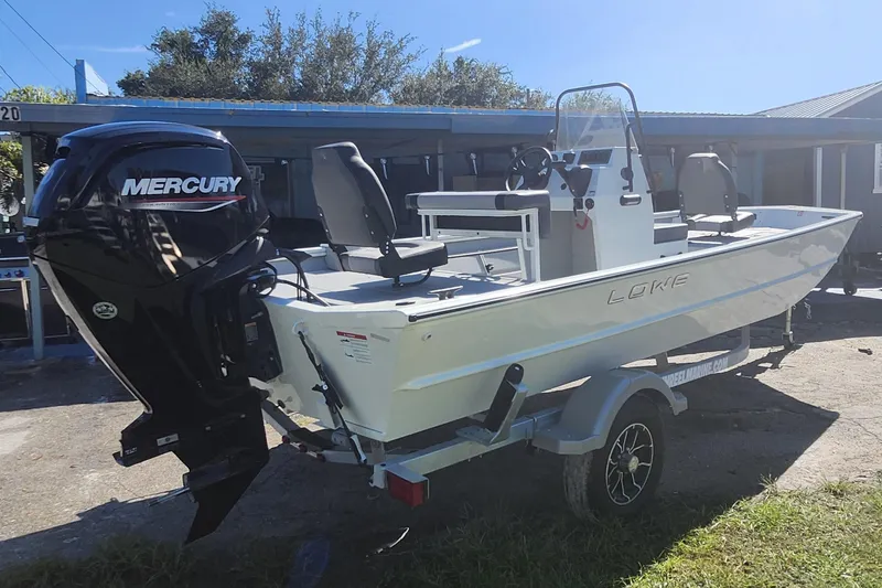 Slide: The Image of 2026 Lowe Roughneck 1860CC boat with Mercury outboard motor on trailer. - 6