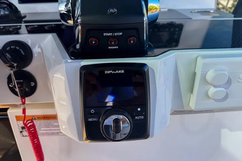 Slide: The Image of Control panel of 2026 De Antonio Yachts D42 featuring Zipwake system and engine start/stop buttons. - 25