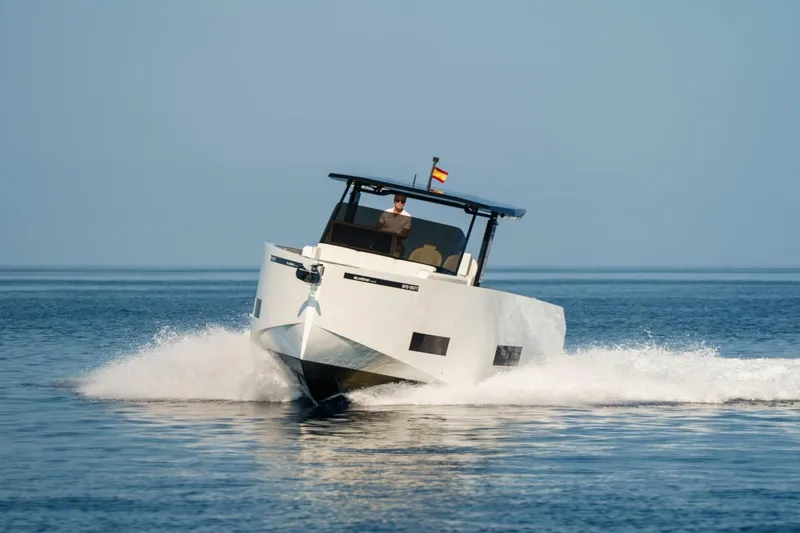 Slide: The Image of Aerial view of 2026 De Antonio Yachts D42 docked, showcasing sleek design and spacious deck. - 3