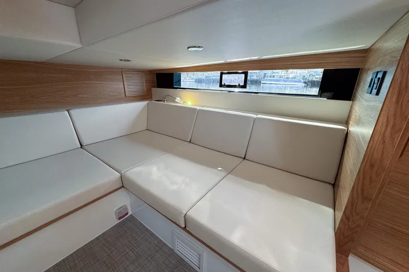 Slide: The Image of Luxurious interior of 2026 De Antonio Yachts D42 with elegant seating and wood accents. - 40