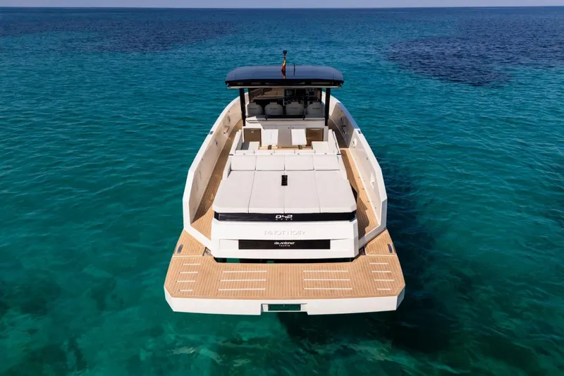 Slide: The Image of Triple outboard engines on 2026 De Antonio Yachts D42, docked on water. - 8