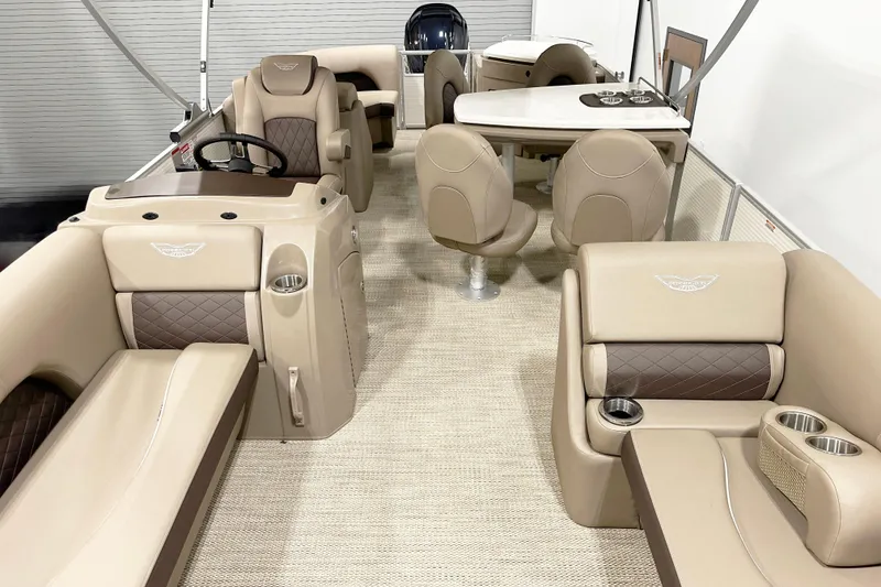 Slide: The Image of 2025 Bennington 23LPDSR pontoon boat interior with luxurious beige seating and modern design. - 8