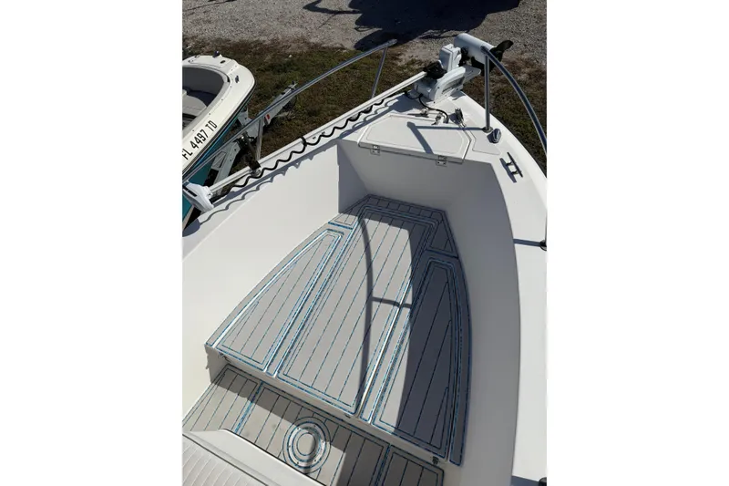 Slide: The Image of 1997 Hydra-Sports 2000 CC boat interior with custom deck padding. - 2