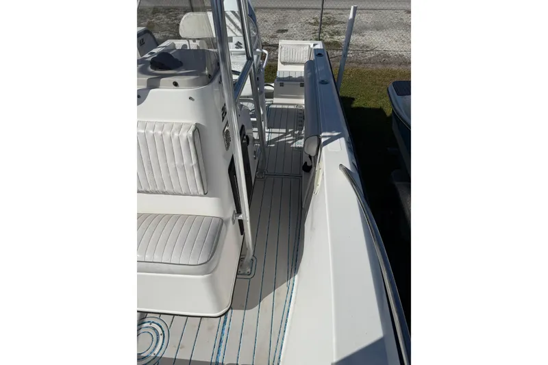 Slide: The Image of 1997 Hydra-Sports 2000 CC boat interior with white seating and striped flooring. - 5